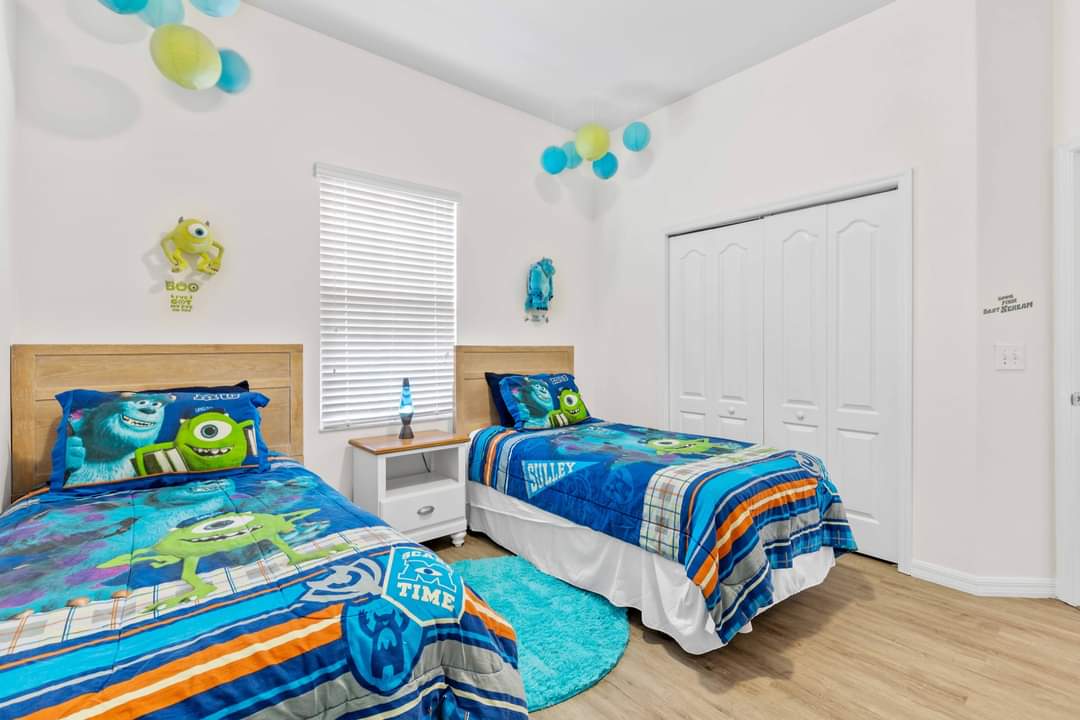 Fun Monsters Inc themed twin bedroom with shared bathroom